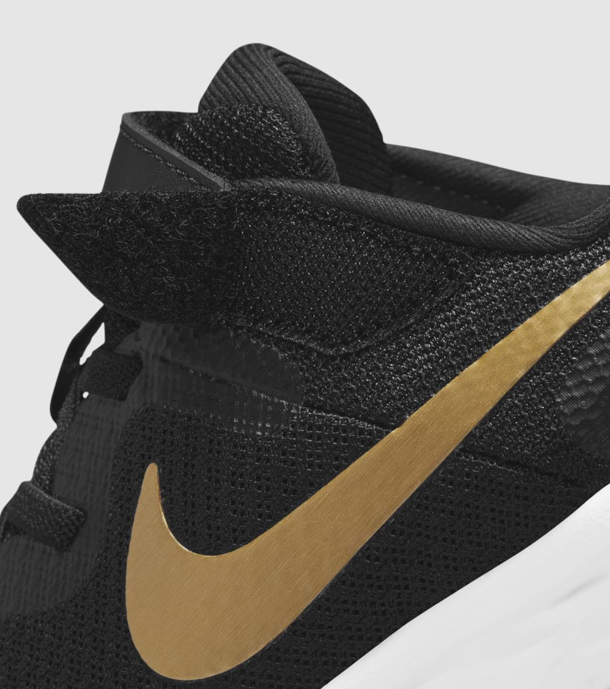 Kids black and gold nike top