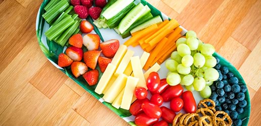 food platter with fruit, vegetables, pretzels