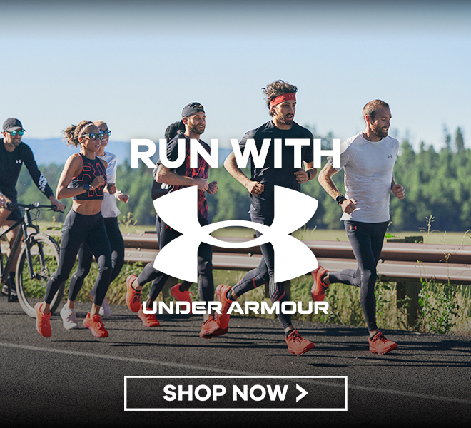 group of people running on road, says Run with Under Armour, Shop Now
